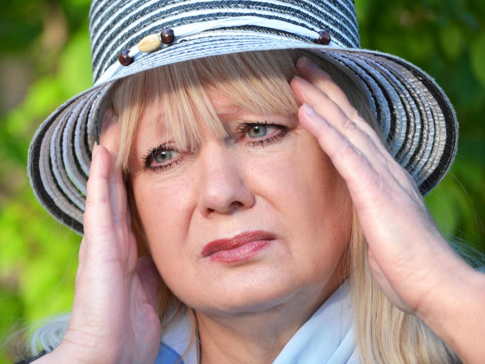 When a group of people simultaneously exhibit similar physical ailments, such as headache and dizziness, it may be referred to as mass hysteria.