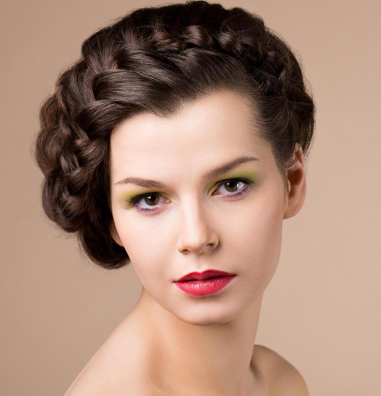 A woman with her hair in a braided up-do.