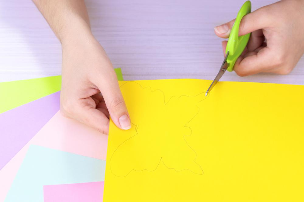 Paper tole project supplies may include different colors of paper and scissors.