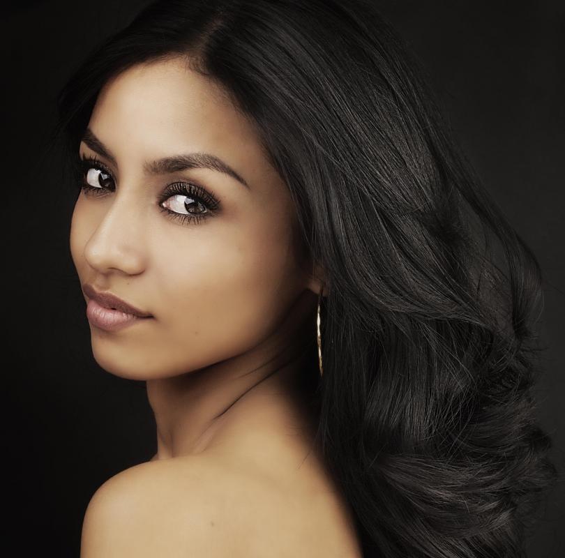 A neutral background is necessary for a good headshot.
