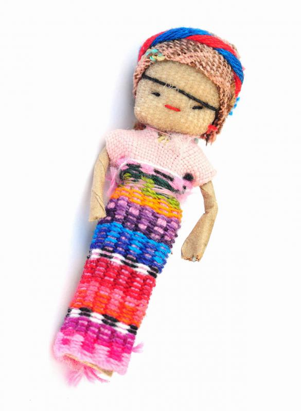 A worry doll with colorful skirt.