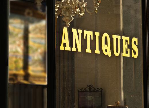 The owner of an antique shop may be able to help customers distinguish whether jewelry is vintage or antique.