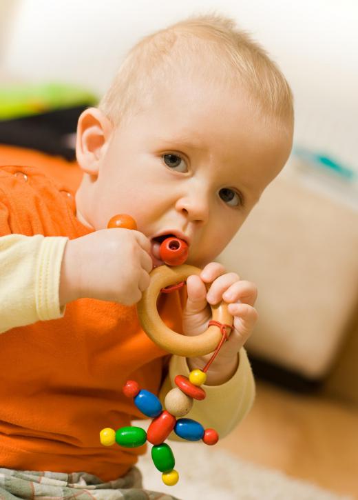 Signs a baby is teething include excessive drooling and fussiness.