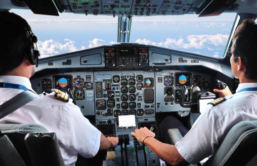 The jet engines on large aircraft are controlled by throttles that are usually situated between the pilot and copilot.